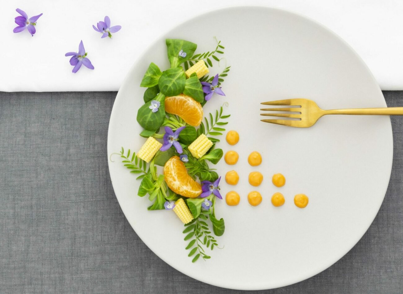 top-view-elegant-plate-with-golden-fork